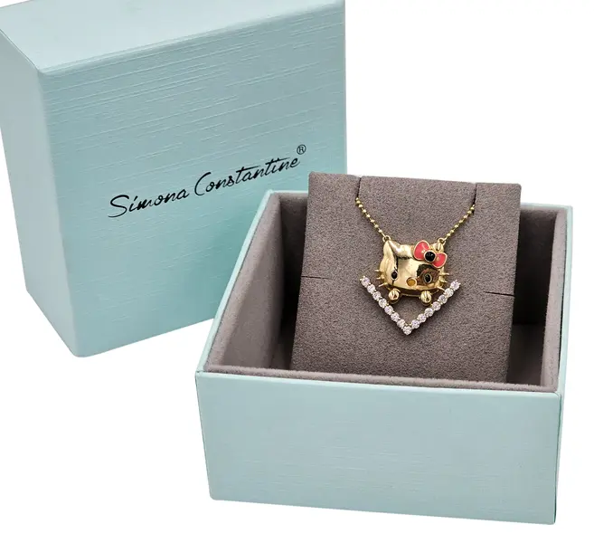 HELLO KITTY FACE NECKLACE ON V STONE BASE WITH RED AND BLACK BOW