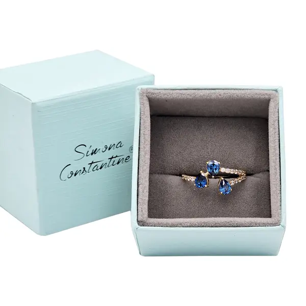NATURA RING BYPASS WITH THREE PEAR SHAPED BLUE AND WHITE SMALL STONES