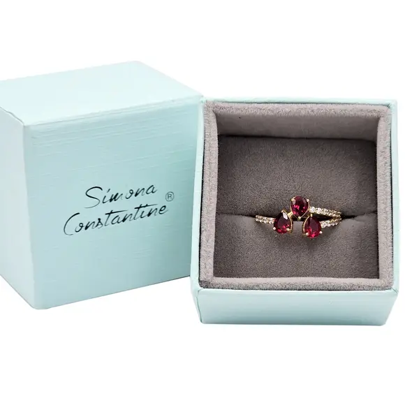 NATURA RING BYPASS WITH THREE PEAR SHAPED RED AND WHITE SMALL STONES