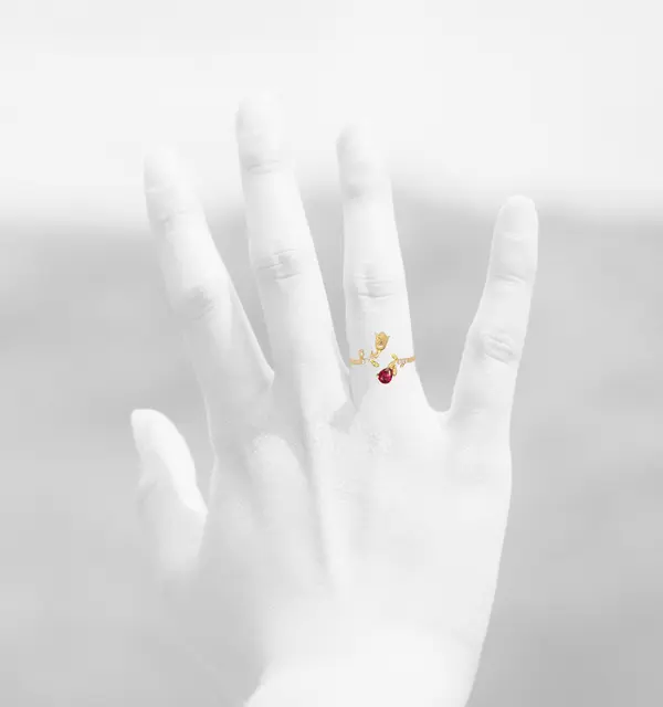 NATURA RING WITH GOLD FLOWER AND RED PEAR CUT CZ