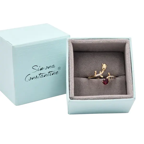 NATURA RING WITH GOLD FLOWER AND RED PEAR CUT CZ