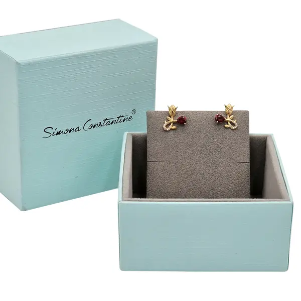 NATURA EARRINGS WITH GOLD FLOWER AND RED PEAR CUT CZ