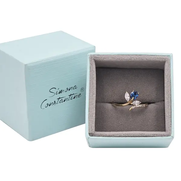 NATURA RING WITH LEAFY BRANCH WHITE AND BLUE STONE