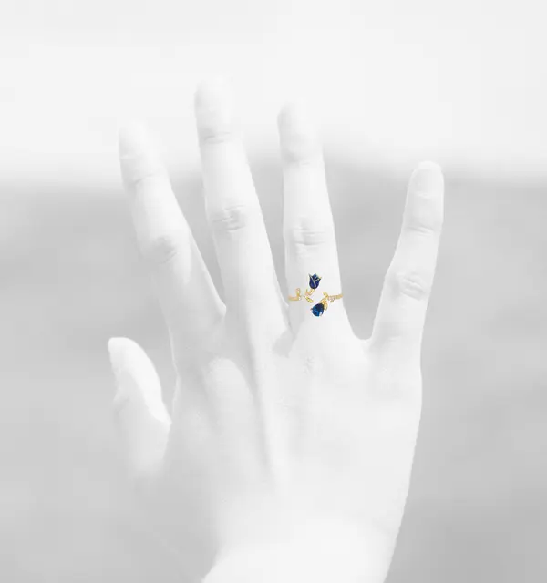 NATURA RING WITH BLUE FLOWER AND BLUE PEAR CUT CZ